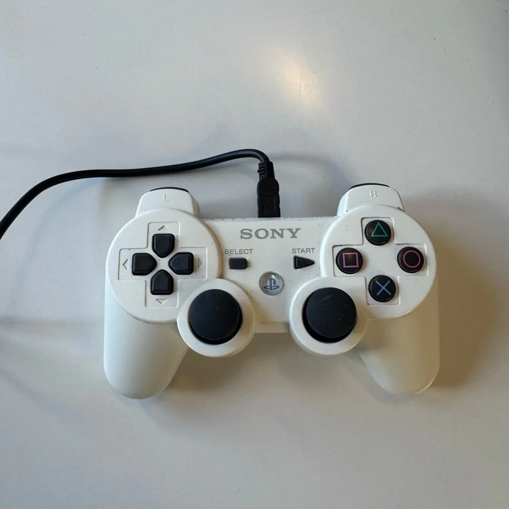 Sony PlayStation 3 Console with Black and White Controllers